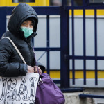 Γυναίκα με μάσκα - Εποχική γρίπη